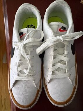 Nike women’s White Sneakers with Black Swoosh and Brown Trim